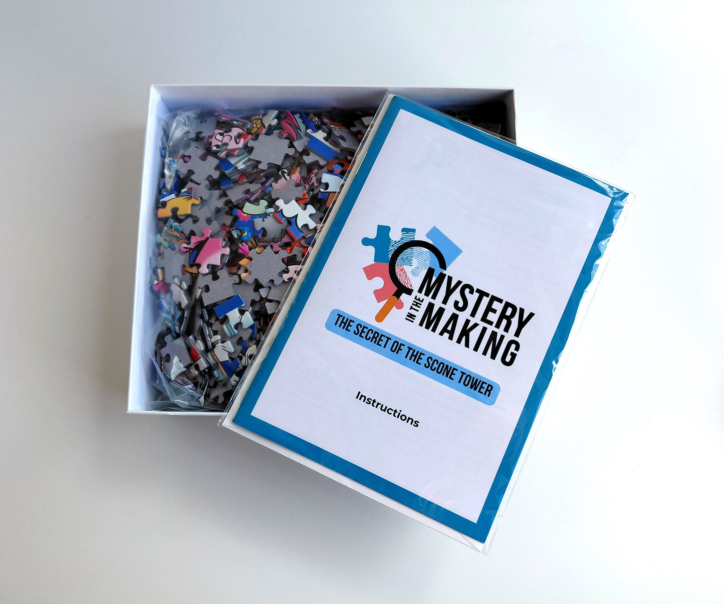 Mystery Jigsaw Puzzle contents including puzzle pieces and instructions 